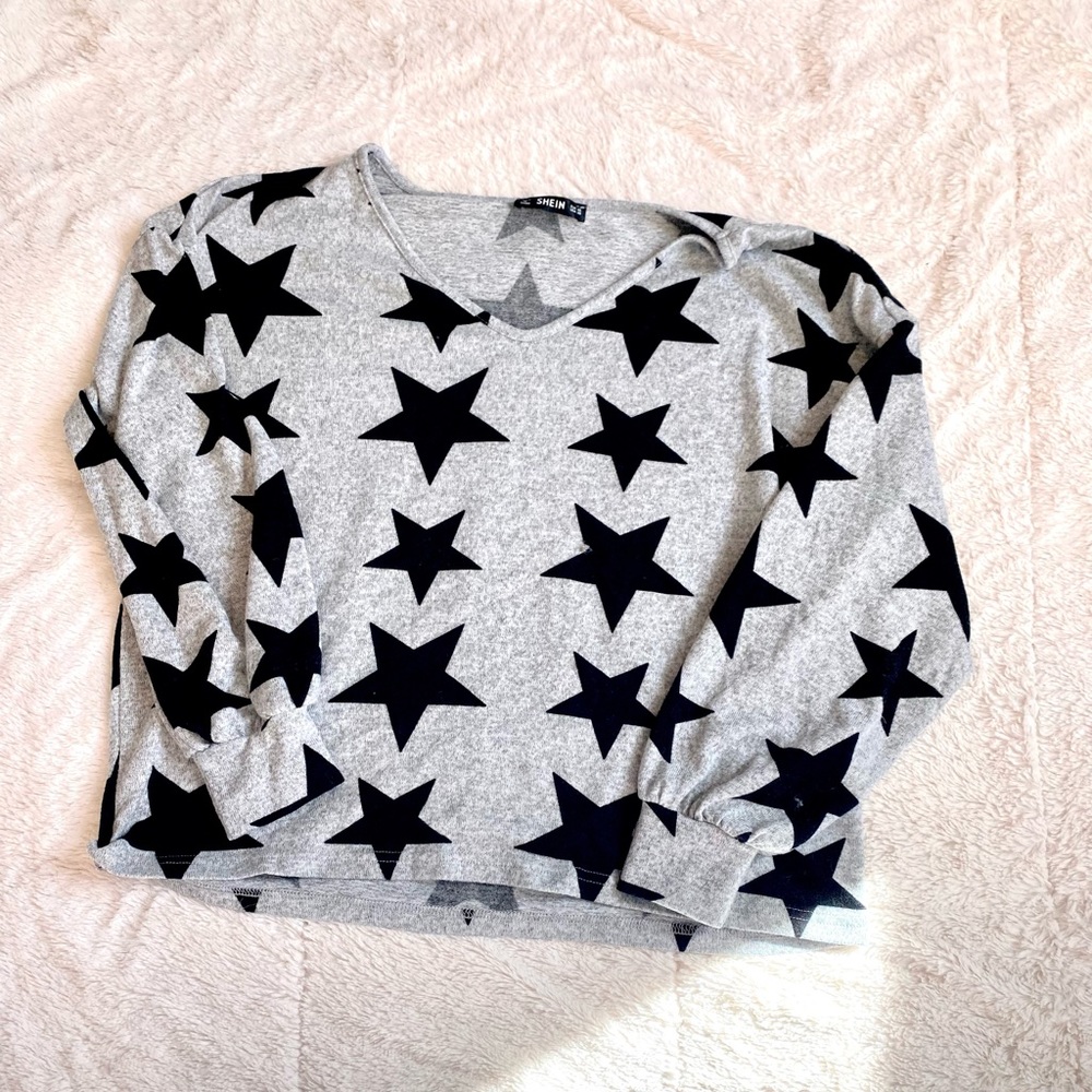 Grey sweater with black stars
